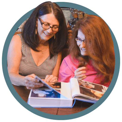 A woman reads a book with her daughter