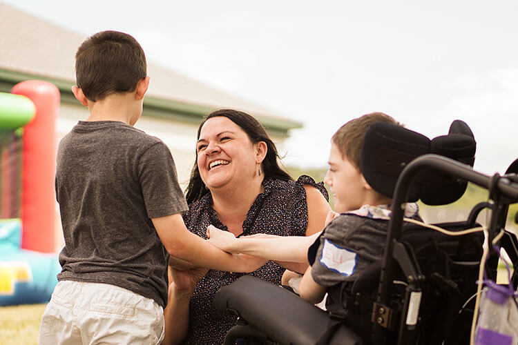 Woman playing with children
