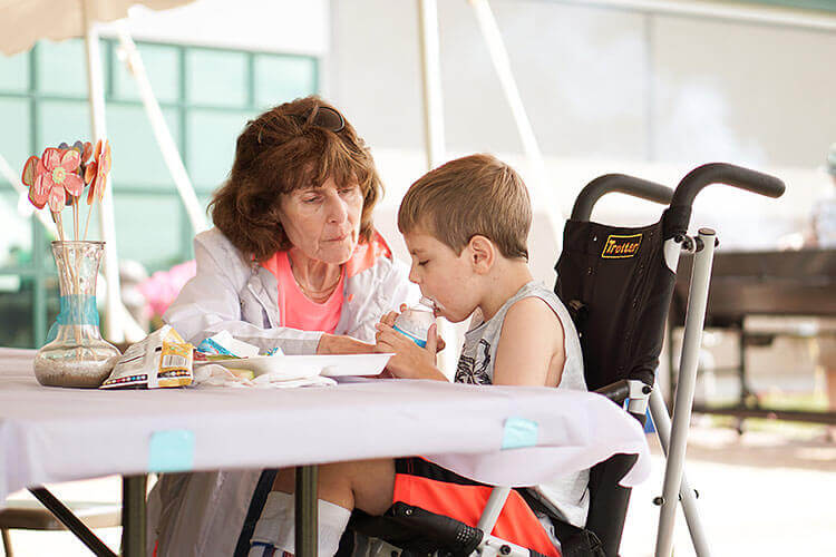 Volunteer helping child