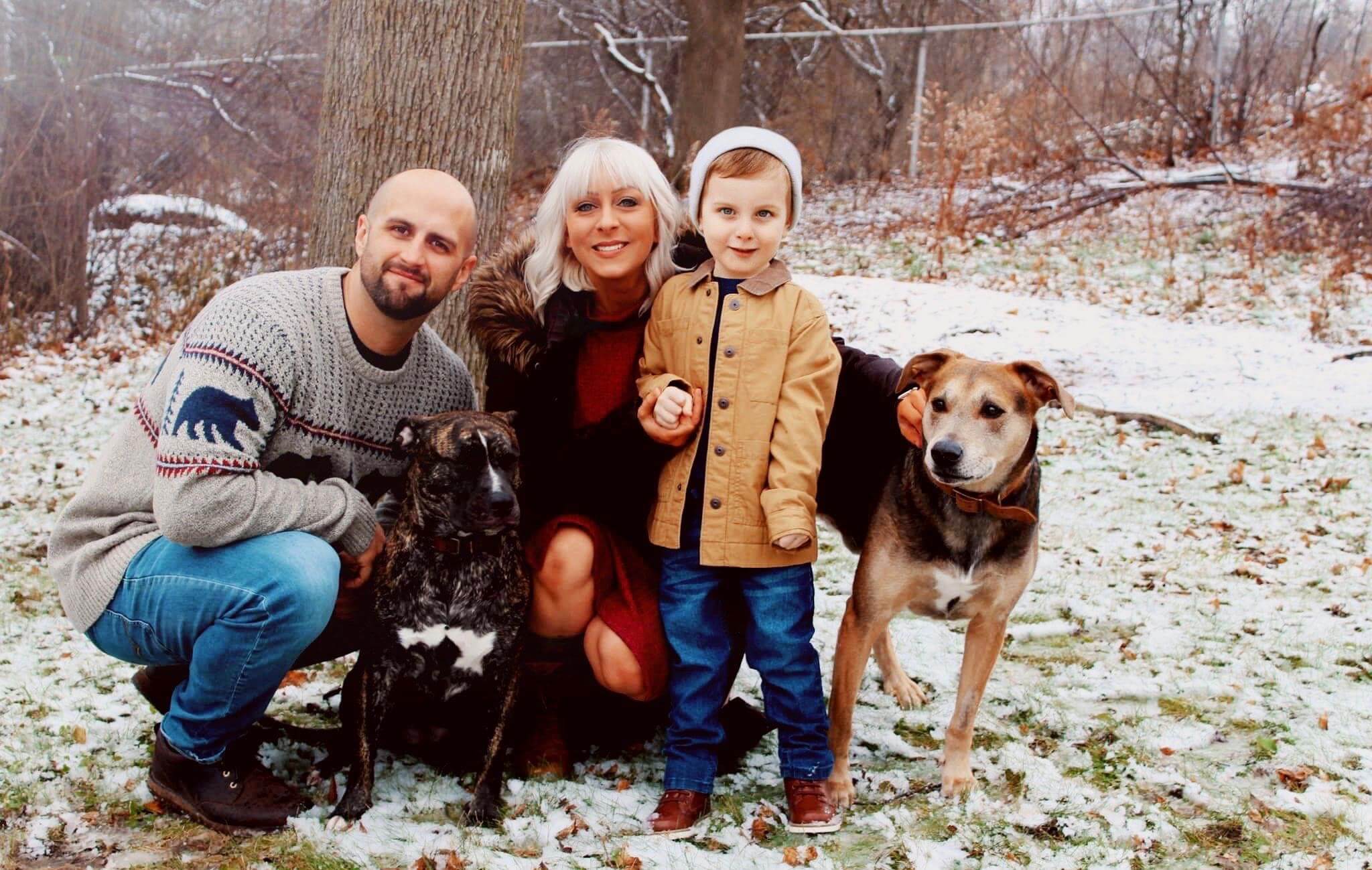 The Chouinard family outdoors smiling